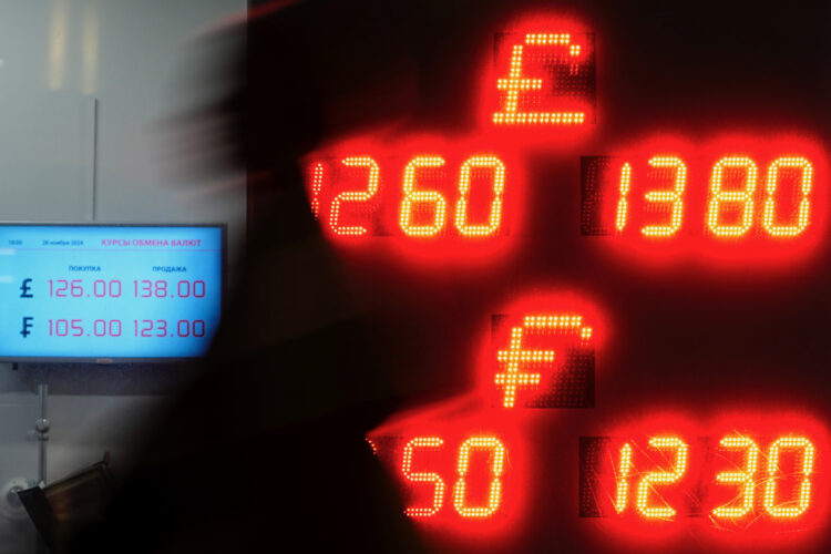 The ruble’s in a slump. For the Kremlin, that’s a two-edged sword